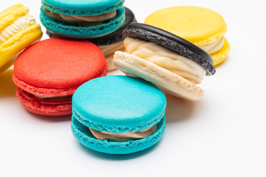 Grouping of brightly colored macaroons on a white background
