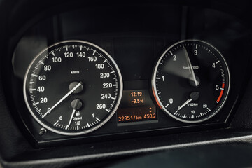 Fototapeta premium Passenger car speedometer with moving indicators. Dashboard with medium mileage and low outdoor temperature