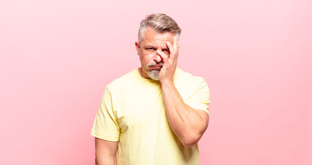 old senior man feeling bored, frustrated and sleepy after a tiresome, dull and tedious task,...