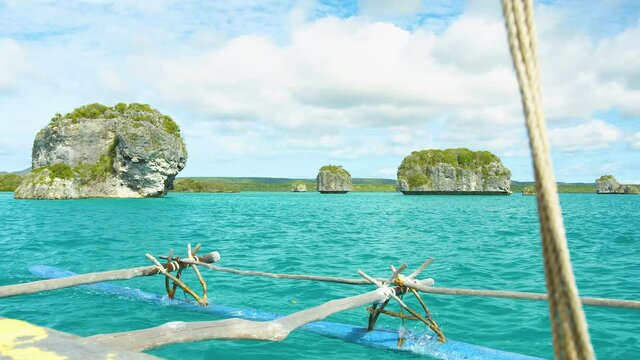 Traditional pirogue tour in the scenic Upi bay, Isle of Pines. New Caledonia