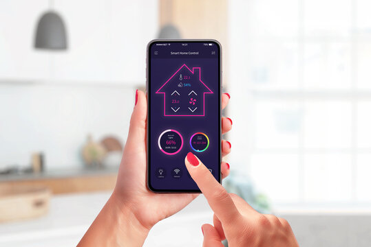 Smart home control app concept on modern phone in woman hands