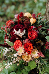 red elegant wedding bouquet of fresh natural flowers