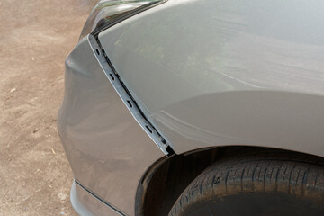 Car crash or accident. Front fender and light damage on bumper. Broken vehicle detail of Private...