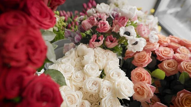 In the frame, there are beautiful bouquets of fresh flowers.