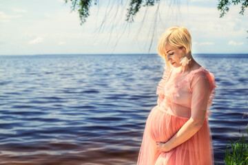 Pregnancy woman near the sea