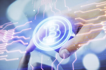 Double exposure of man's hands holding and using a phone and crypto currency blockchain theme drawing.