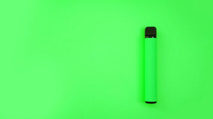 Green disposable electronic cigarette on bright background