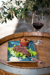 Tasty fresh Tagliatta Steak served with grilled vegetables, rucola
