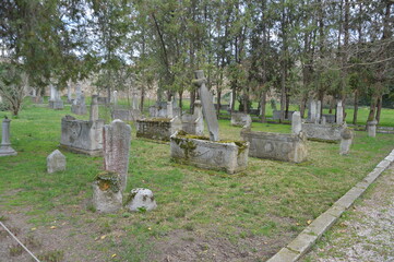 old stone cross in cemetery