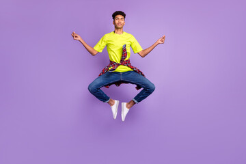 Full length body size photo of young hipster jumping up doing yoga asana calm peaceful isolated on pastel purple color background