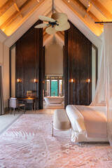 Luxurious interior of a very expensive rich water villa in the Maldives, decorated with natural...