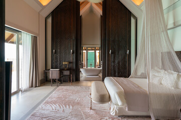Luxurious interior of a very expensive rich water villa in the Maldives, decorated with natural...