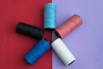 Set of yarns on a colored background