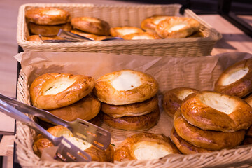 buns with curd filling in baskets in bakery