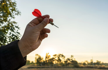 Success goals Targeting the business concept. Businessman throwing red arrow dart to virtual...