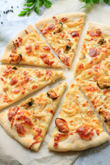 pizza seafood cream sauce mussels, shrimps, squid, sea reptiles healthy meal top view copy space food background rustic