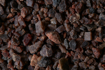 rock himalayan salt on black stone surface