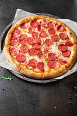 pizza cheese, sausage, tomato sauce meal top view copy space food background rustic
