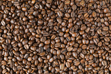 Detailed background of roasted coffee beans - top view