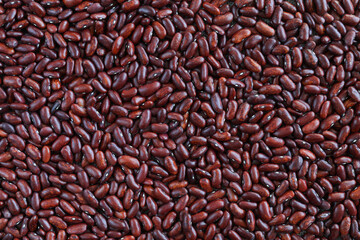 Background of red string beans scattered on the table