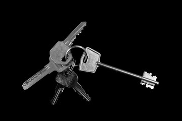 Bunch of keys on a black background,isolated .