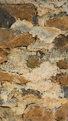 detail section of empty stone wall built with cement, closeup background texture