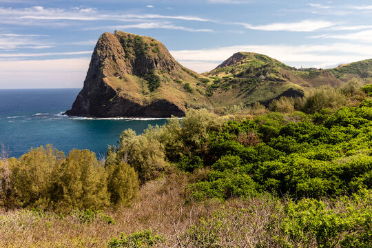 A tall mesa emerges from the Pacific Ocean near Kahakuloa along the Kahekili Highway in northwest Maui, Hawaii
