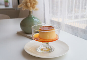 High angle view of dessert  caramel custard pudding in plate on table