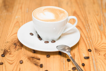 Delicious and aromatic cappuccino coffee on the table in a coffee shop