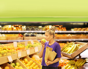 Woman buying fruits at the market