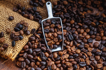 Fototapeta premium Coffee beans in sacks On a brown background