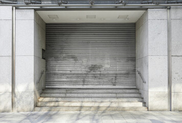 closed department store with rolling shutters - business closure