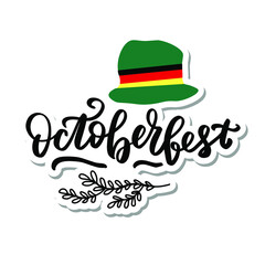October fest sticker logo with green ha, ribbon German flag colors. Hand lettering brush calligraphy.  typography for Octoberfest holidays greeting card, invitation, banner, postcard, web, poster