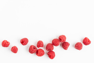 Fresh raspberries background top view. White background with raspberry berries.