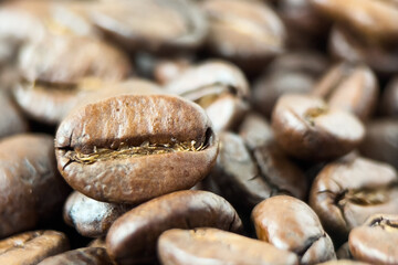 Roasted coffee beans background closeup.