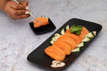 Delicious Japanese food with salmon and soy sauce
