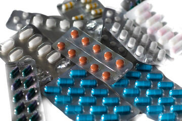 Pile of medicine pills and capsules in blister packs