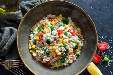 Rice salad with tuna and vegetables. Top view with copy space. Healthy food.