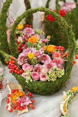 Obraz na płótnie Canvas Beautiful flowers in a basket