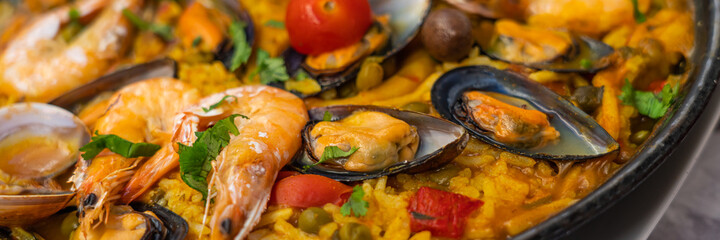 Spanish seafood Paella de Marsico, with scampi mussels reis, Safran, tomato, Paella Marinera