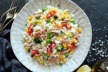 Rice salad with tuna and vegetables. Top view with copy space. Healthy food.