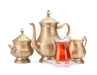 Set with glass of tasty Turkish tea on white background