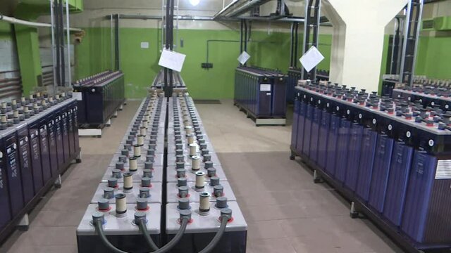 Rows of industrial storage batteries.A room used for backup or uninterruptible power supply. Power station.