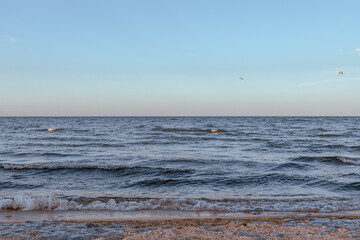 Fototapeta premium small sea waves in the sea on a clear warm day. Summer vacation near the water