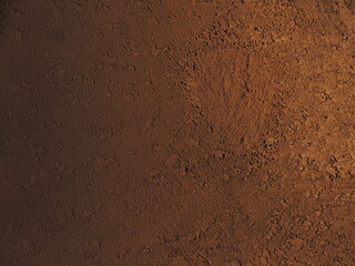 Textured background with shadows and light from the sun. Dark background. Desktop background. Black, gray, and yellow. Venetian plaster.