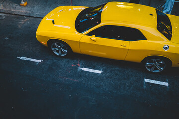 Yellow car parked on city street