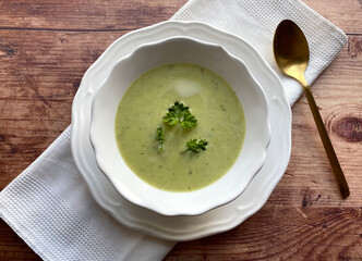Healthy zucchini cream soup with parsley.