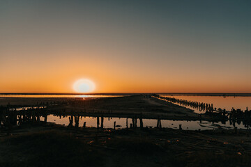 Fototapeta premium Dawn or sunset on the seashore. A place to relax in summer