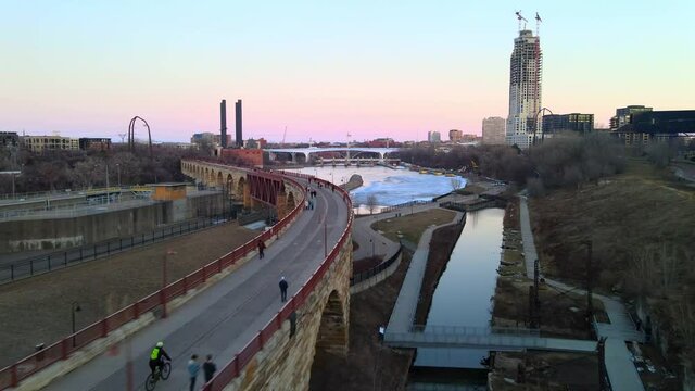 Stone arch bridge in North Minneapolis aerial footage during a wonderful afternoon, visit msp, meet minneapolis minnesota