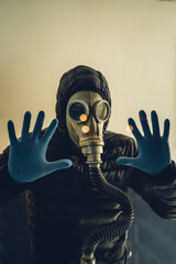 man with gas mask and latex gloves